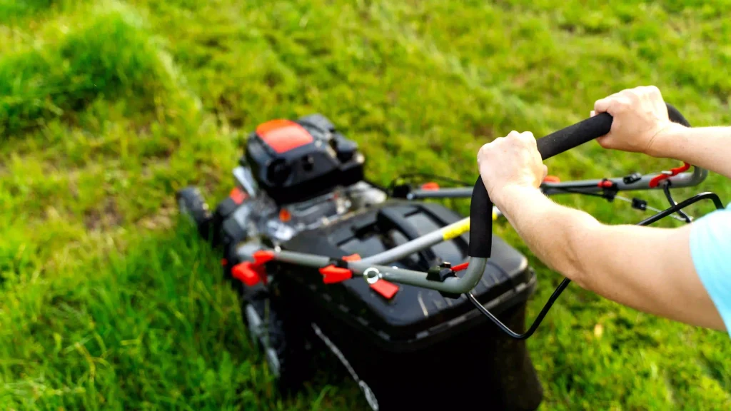 cutting grass with lawn mower